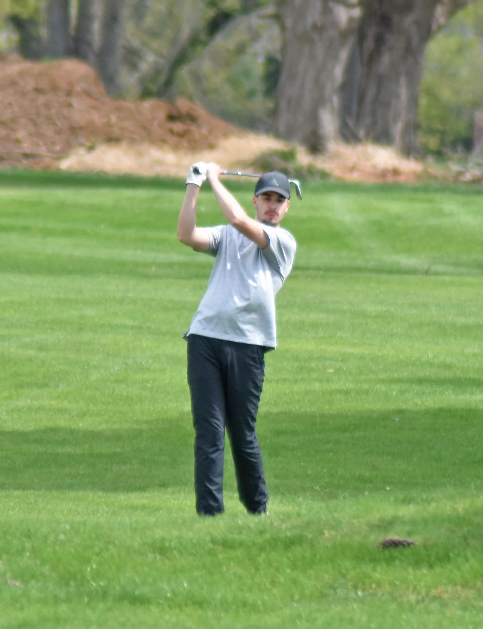 Coldwater's Talan Eberts hits an approach shot at 18 at Thursday's Coldwater Invitational