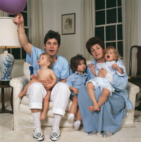 <p>Dave Hogan/Hulton Archive/Getty</p> Ozzy and Sharon Osbourne with kids Aimee, Kelly and Jack in 1987