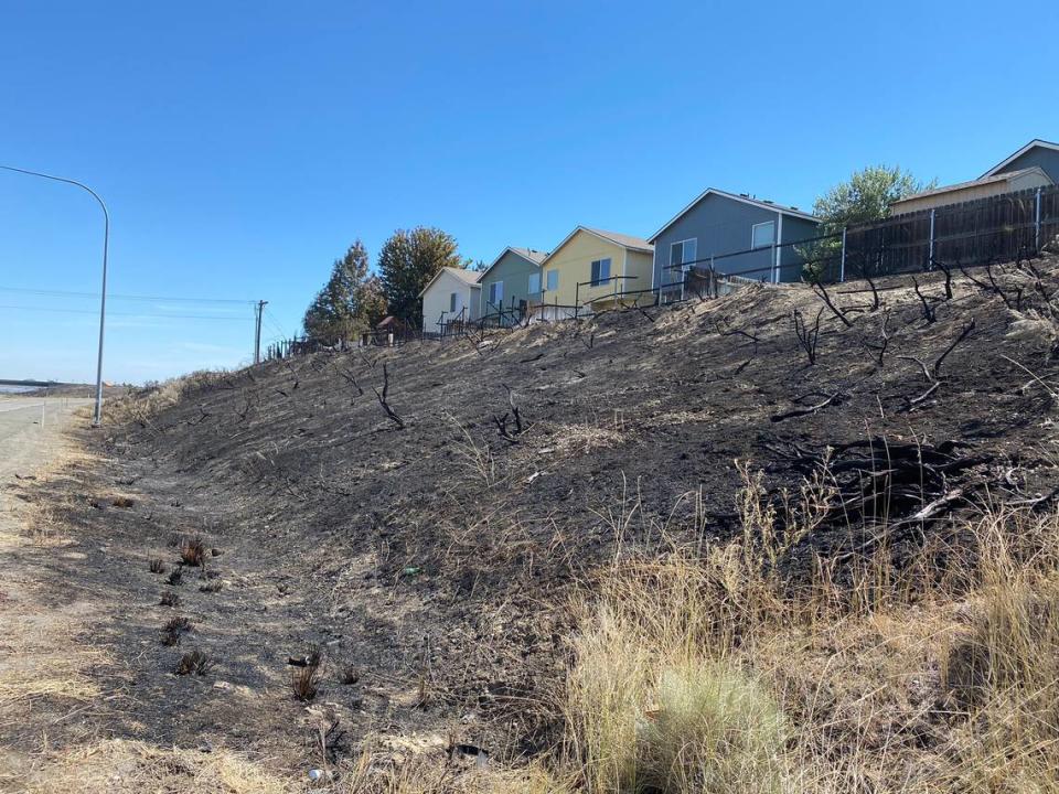 This photo shows how close a wildfire came to reaching south Richland homes and their fences that burned Saturday night.