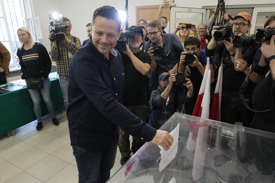 Warsaw Mayor Rafal Trzaskowski, who belongs to Prime Minister Donald Tusk's ruling party, votes during local elections in Warsaw, Poland, Sunday, April 7, 2024. Voters across Poland are casting ballots in local elections Sunday in the first electoral test for the coalition government of Prime Minister Donald Tusk nearly four months since it took power. (AP Photo/Czarek Sokolowski)