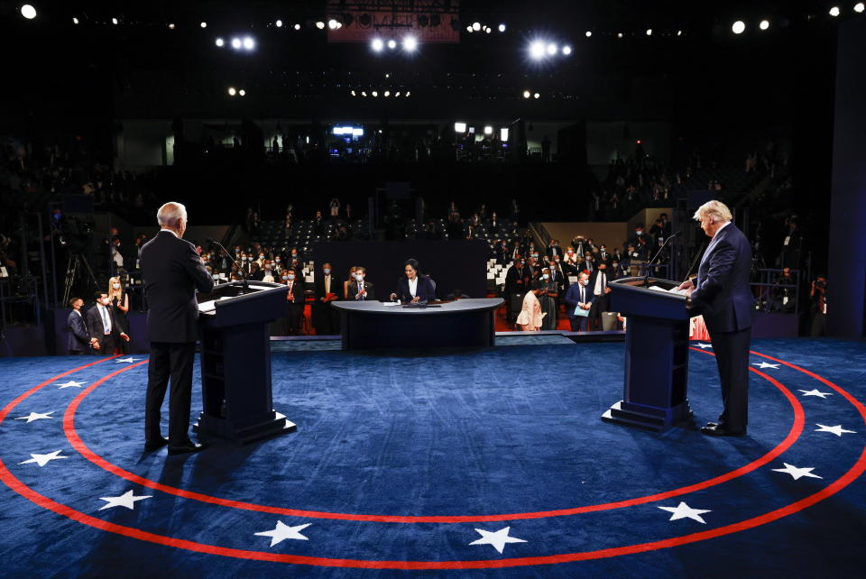 Joe Biden (left) and US President Donald Trump (right) pictured on stage. 