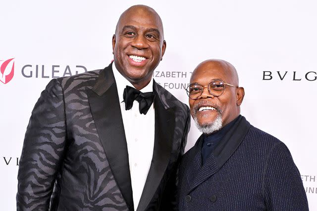 <p>Axelle/Bauer-Griffin/FilmMagic</p> Magic Johnson and Samuel L. Jackson pose for a photo at The Elizabeth Taylor Ball to End AIDS in September 2023