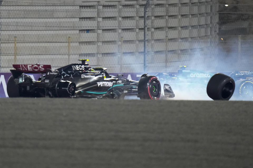 Mercedes driver Lewis Hamilton of Britain crashes at the start of the Qatar Formula One Grand Prix auto race at the Lusail International Circuit, in Lusail, Qatar, Sunday, Oct. 8, 2023. (AP Photo/Darko Bandic)