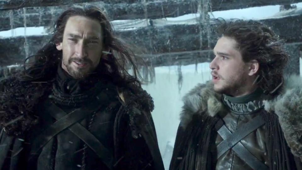 Benjen Stark and Jon Snow talk atop the Wall in falling snow on Game of Thrones