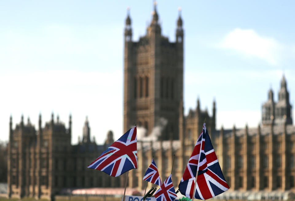 British Union flags fly in front of The Houses of Parliament in London, Tuesday, Jan. 22, 2019. British Prime Minister Theresa May launched a mission to resuscitate her rejected European Union Brexit divorce deal, setting out plans to get it approved by Parliament. (AP Photo/Frank Augstein)