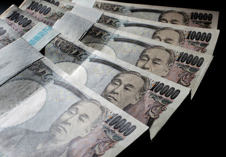 Illustrative picture shows Japanese 10,000 yen bank notes spread out at an office of World Currency Shop in Tokyo in this August 9, 2010 illustrative picture. REUTERS/Yuriko Nakao/File Photo