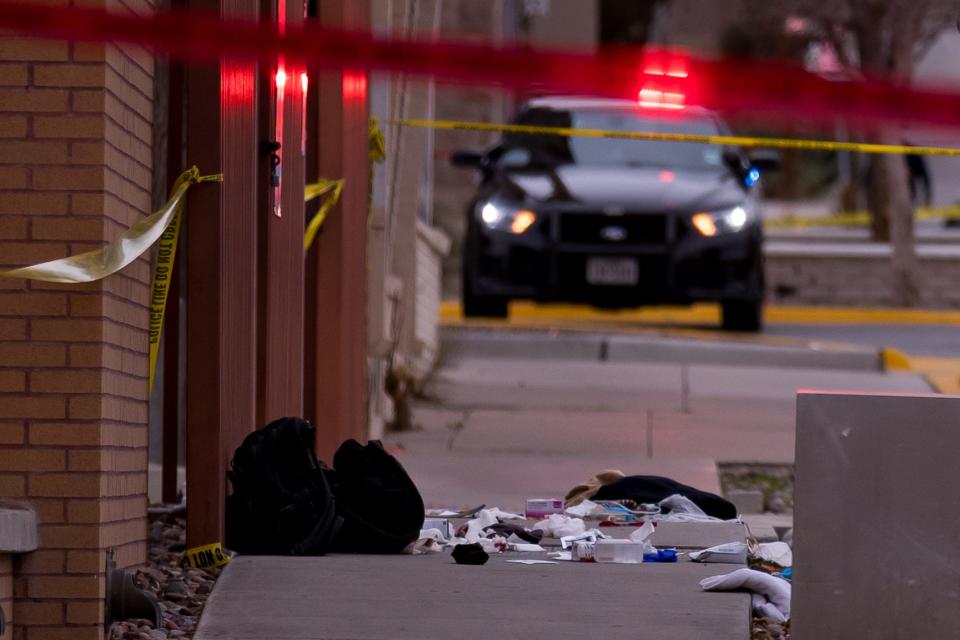 A pile of what appears to be clothes and blankets is on a sidewalk as El Paso police officers investigate a stabbing that wounded two men on Feb.6 on Yandell Drive and nearby streets in the Central area just north of Downtown.
