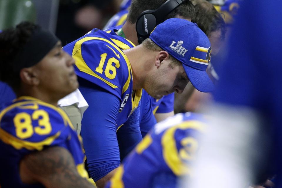 Los Angeles Rams' Jared Goff, center, reacts on the bench after throwing an interception caught by New England Patriots' Stephon Gilmore during the second half of the NFL Super Bowl 53 football game Sunday, Feb. 3, 2019, in Atlanta. (AP Photo/Patrick Semansky)