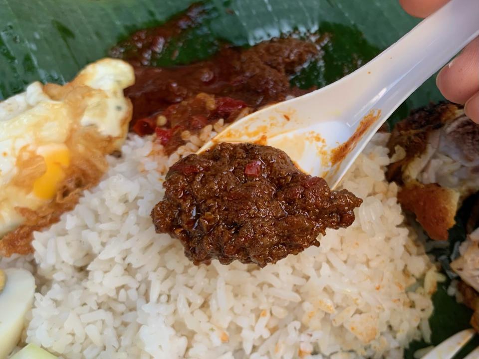 Nasi Lemak Alor Corner - Spoon of rendang gravy