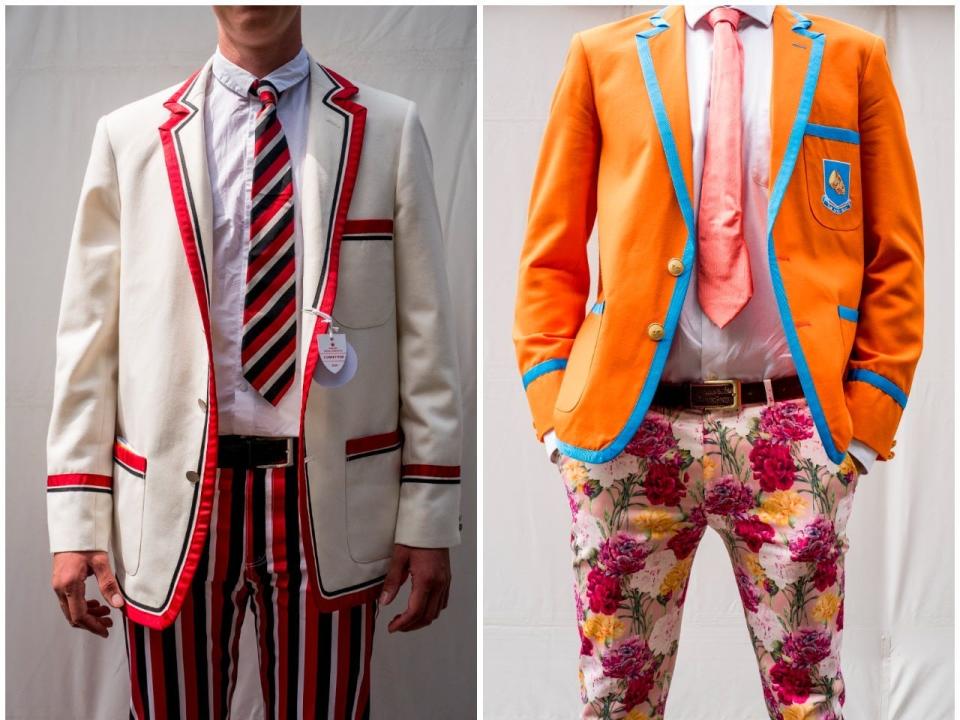 Two men pose for photographs of their outfits at the 2019 Royal Henley Regatta.