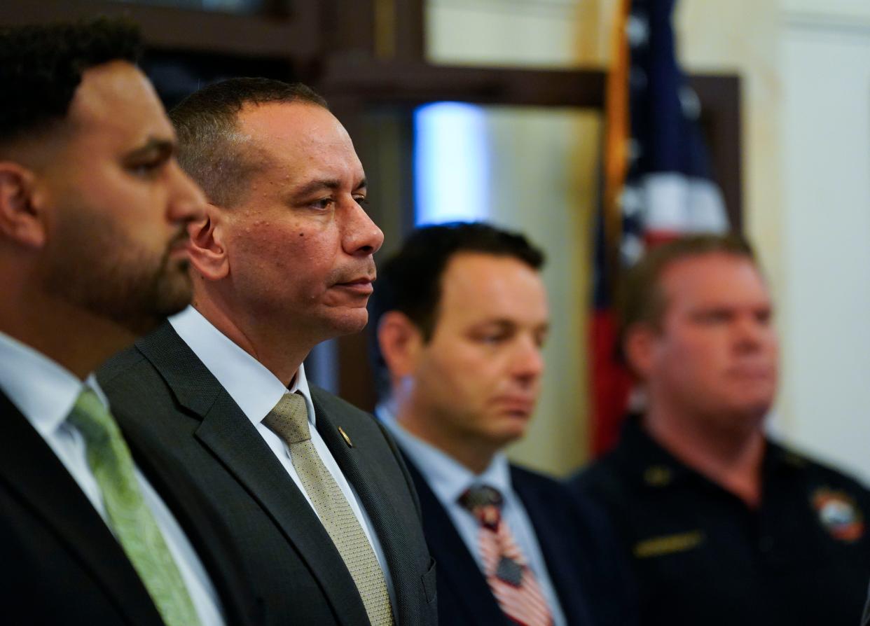 Isa Abbassi (second from left), officer in charge of the Paterson Police Department, attends a press conference on a new anti-crime initiative with Mayor Andre Sayegh (third from left) at Paterson City Hall on Monday, June 26, 2023.