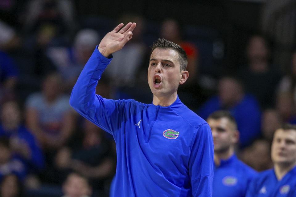 Florida head coach Todd Golden gestures during the first half of an NCAA college basketball game against Auburn, Saturday, Feb. 10, 2024, in Gainesville, Fla. (AP Photo/Alan Youngblood)