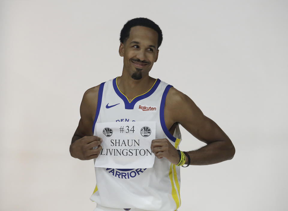 Golden State Warriors guard Shaun Livingston poses for photos during media day at the NBA basketball team's practice facility in Oakland, Calif., Monday, Sept. 24, 2018. (AP Photo/Jeff Chiu)