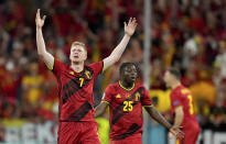 Belgium's Kevin De Bruyne, left, reacts during the Euro 2020 soccer championship quarterfinal match between Belgium and Italy at the Allianz Arena stadium in Munich, Germany, Friday, July 2, 2021. (AP Photo/Matthias Schrader, Pool)