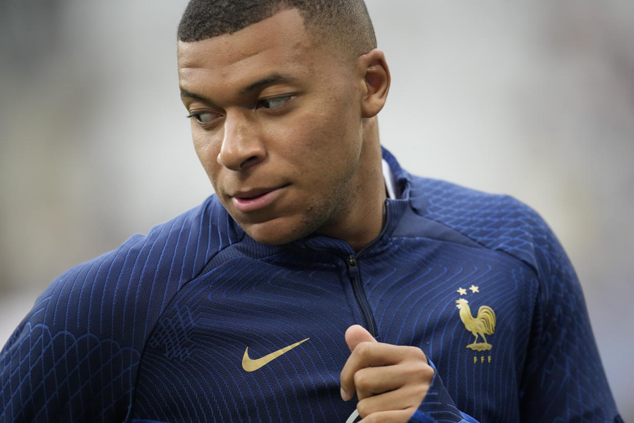 France's Kylian Mbappe warms up before the Euro 2024 group B qualifying soccer match between France and Greece at the Stade de France, outside Paris, Monday, June 19, 2023. (AP Photo/Christophe Ena)