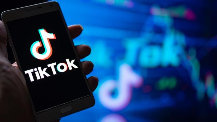 A TikTok logo on a phone