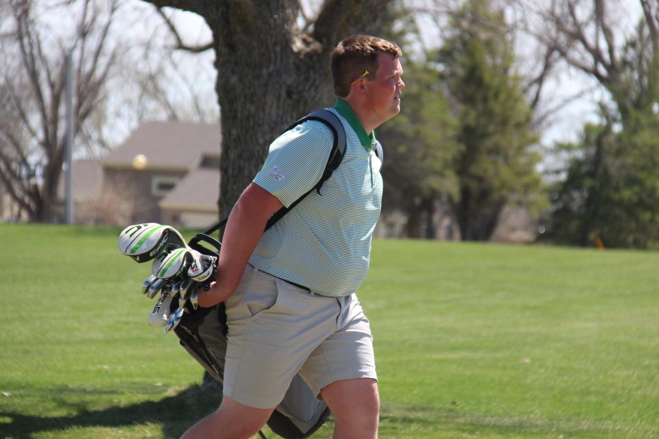 Woodward-Granger's Tabor Lettow heads to the next hole during an invitational on Thursday, April 13, 2023, at Woodward Golf Club.