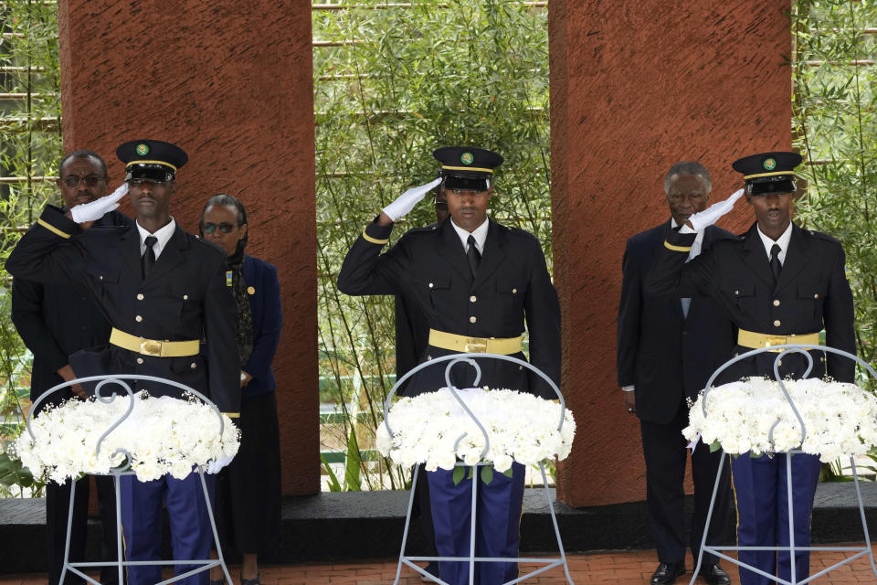 Rwandan military personnel salute in preparation of dignitaries to lay a wreath at the Kigali Genocide Memorial in Kigali, Sunday, April 7, 2024. Rwandans are commemorating 30 years since the genocide in which an estimated 800,000 people were killed by government-backed extremists, shattering this small east African country that continues to grapple with the horrific legacy of the massacres. (AP Photo/Brian Inganga)