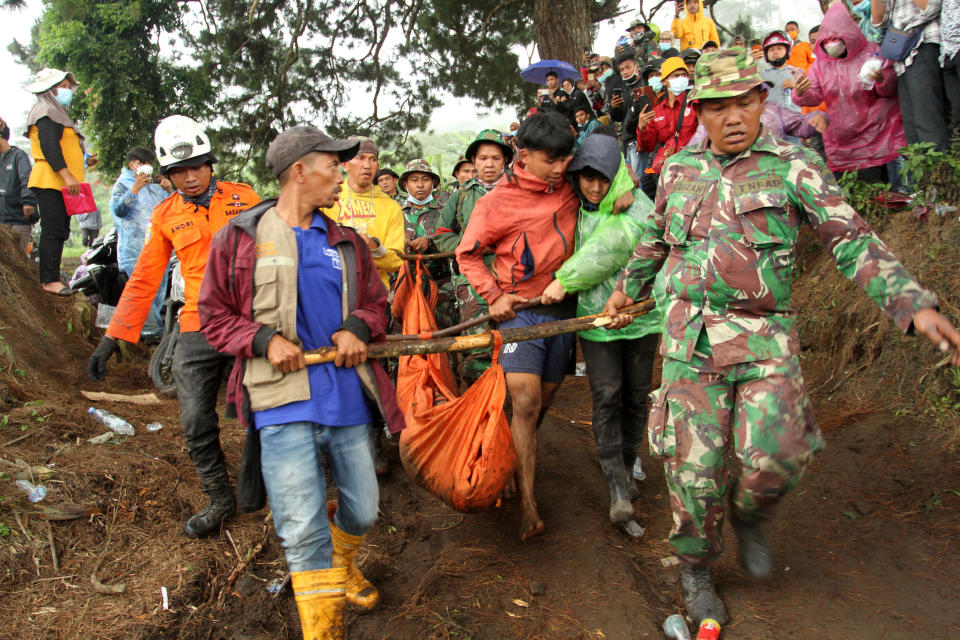Indonesian rescue teams carry the body of a Mount Marapi eruption victim in Nagari Batu Plano, Agam, West Sumatra province, Indonesia, Dec. 5, 2023. / Credit: Antara Foto/Muhammad Arif Pribadi via REUTERS
