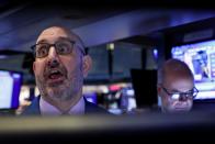 Traders work on the floor at the NYSE in New York