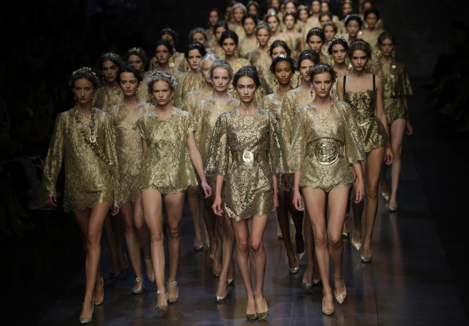 Models wear creations for Dolce & Gabbana women's Spring-Summer 2014 collection, part of the Milan Fashion Week, unveiled in Milan, Italy, Sunday, Sept. 22, 2013. (AP Photo/Luca Bruno)