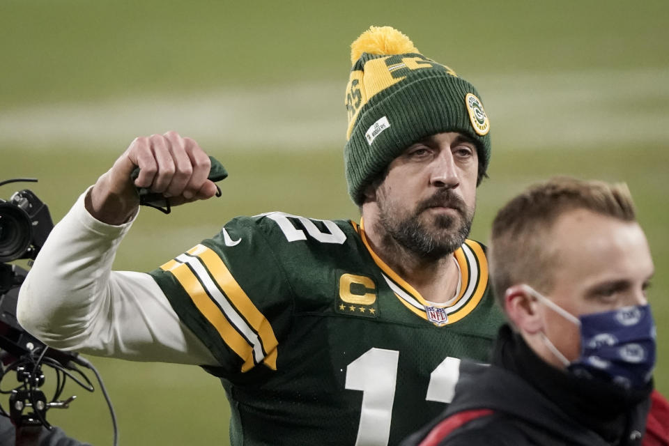 Green Bay Packers quarterback Aaron Rodgers pumps his first after an NFL divisional playoff football game against the Los Angeles Rams Saturday, Jan. 16, 2021, in Green Bay, Wis. The Packers defeated the Rams 32-18 to advance to the NFC championship game. (AP Photo/Morry Gash)