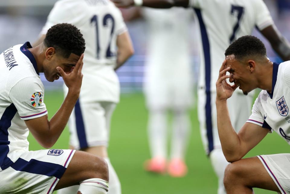 England’s Jude Bellingham celebrates scoring his team's first goal with teammate Trent Alexander-Arnold  (Eddie Keogh / the FA via Getty Images)