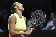 Belarus' Aryna Sabalenka reacts during her quarterfinals tennis match against Czech Republic's Marketa Vondrousova at the WTA Tour in Stuttgart, Germany, Friday April 19, 2024. (Marijan Murat/dpa via AP)