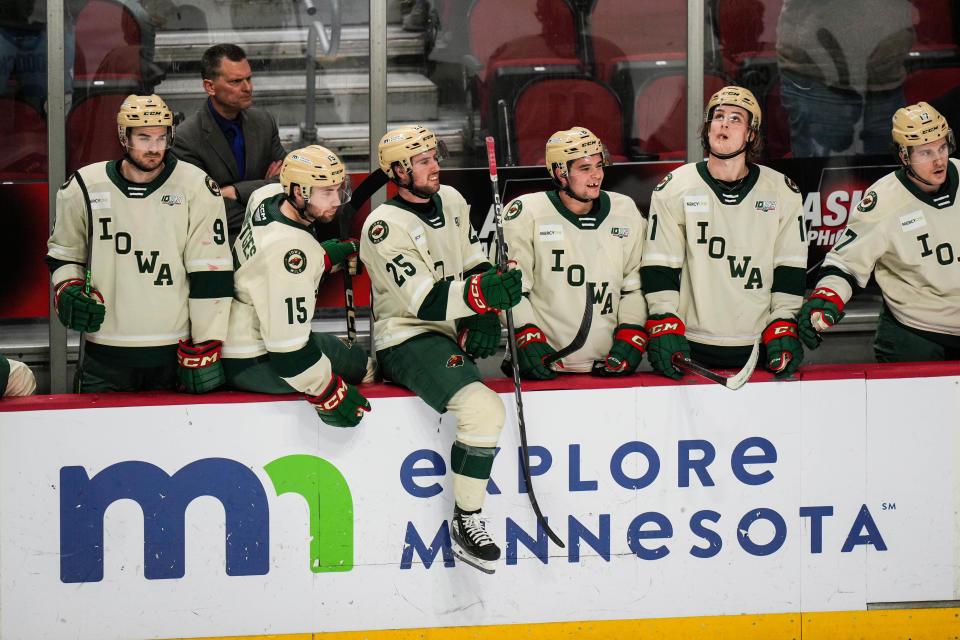 Iowa Wild forward Sammy Walker, seen here cheering for his teammates in a game last season, has returned to Des Moines for the new season.