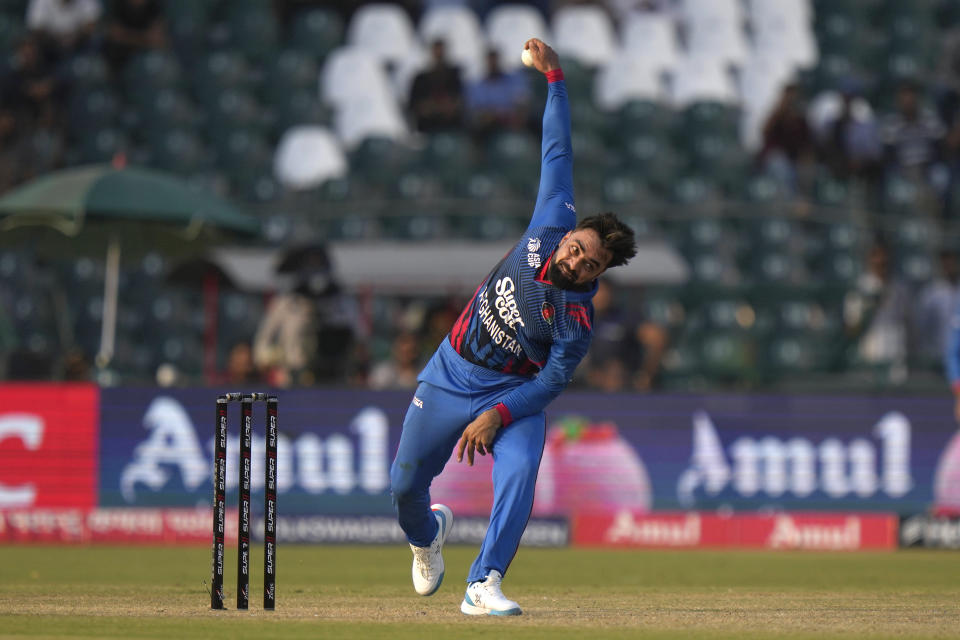 Afghanistan's Rashid Khan bowls during the Asia Cup cricket match between Afghanistan and Sri Lanka in Lahore, Pakistan, Tuesday, Sept. 5, 2023. (AP Photo/K.M. Chaudary)