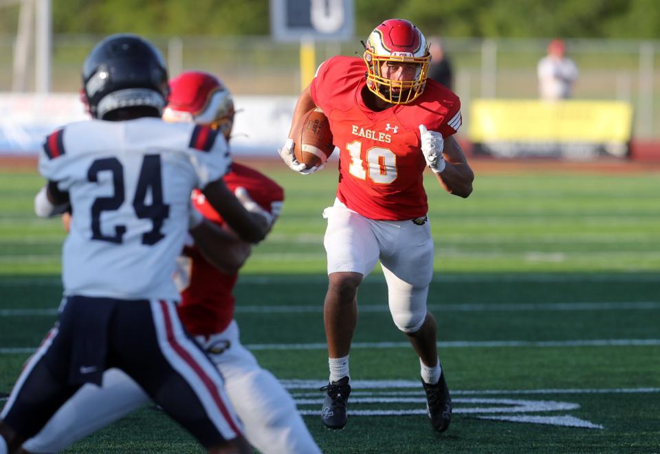 Big Walnut's Garrett Stover carries the ball down field during a game against Hartley on Aug. 19 at Big Walnut High School in Sunbury.