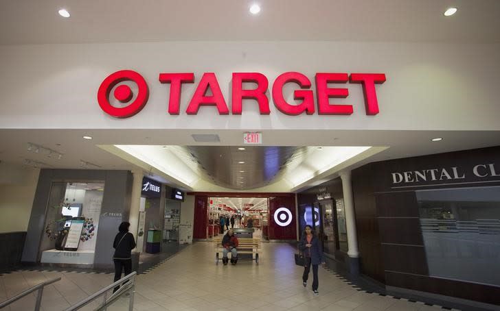 People are seen in front of a Target store in Delta, British Columbia January 15, 2015. REUTERS/Ben Nelms