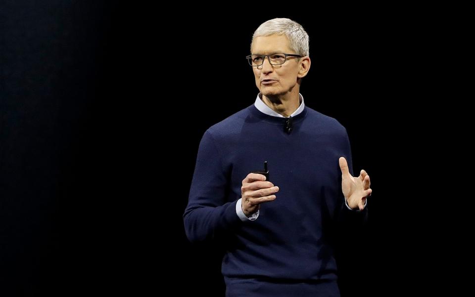 Apple boss Tim Cook on stage during the Worldwide developer's conference in June 2017 - AP