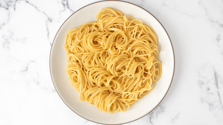 spaghetti on white plate