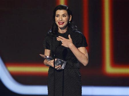 Actress Juliana Marguiles accepts the award for favorite network TV drama for her show "The Good Wife" at the 2014 People's Choice Awards in Los Angeles, California January 8, 2014. REUTERS/Mario Anzuoni