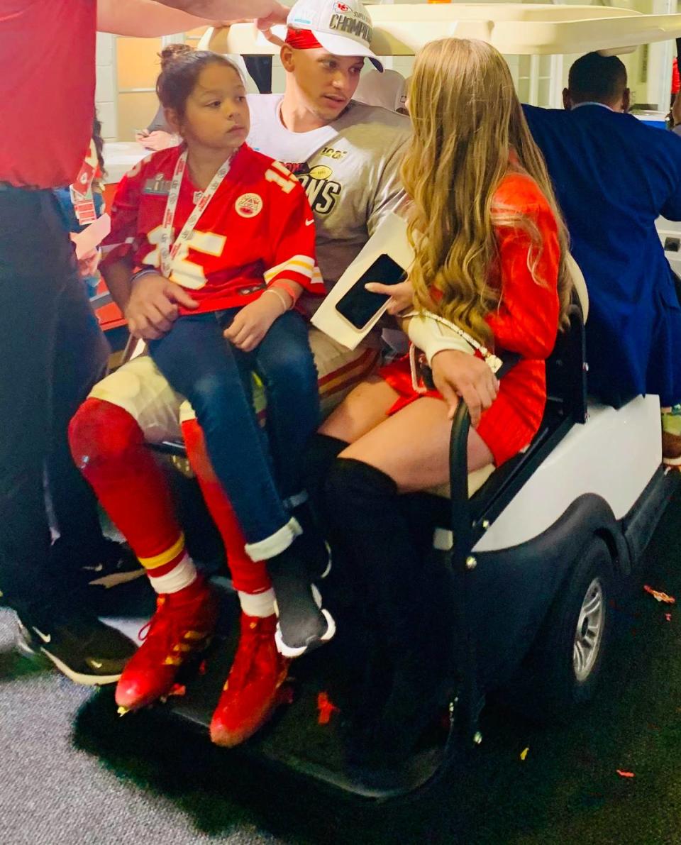 Patrick Mahomes, the Chiefs’ Super Bowl MVP quarterback, arrives at the KC locker room inside Hard Rock Stadium on a golf court with his girlfriend, Brittany Matthews, and younger sister.