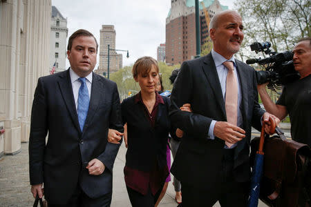 Actor Allison Mack, known for her role in the TV series “Smallville”, arrives with her lawyers for a hearing on charges of sex trafficking in relation to the Albany-based organization Nxivm at United States Federal Courthouse in Brooklyn, New York, U.S., May 4, 2018. REUTERS/Brendan McDermid