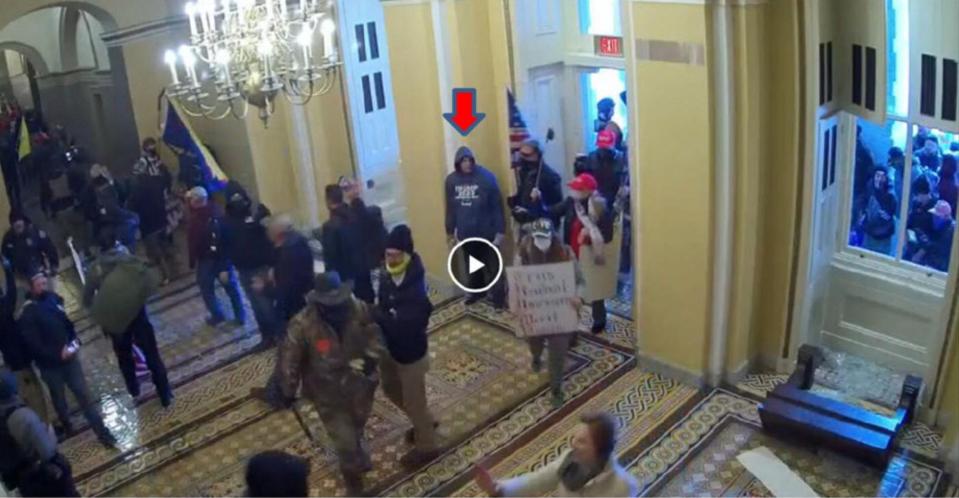 Kenneth Rader, of Sioux City, will plead guilty to parading or picketing in the U.S. Capitol during the Jan. 6, 2021, riots, prosecutor say. This screenshot from security camera footage shows him in a blue sweatshirt inside Capitol.