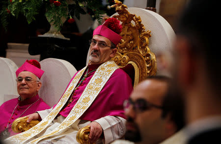 The acting Latin Patriarch of Jerusalem Pierbattista Pizzaballa attends a mass at the Church of the Nativity on Christmas eve, in Bethlehem, in the Israeli-occupied West Bank December 24, 2018. REUTERS/Raneen Sawafta