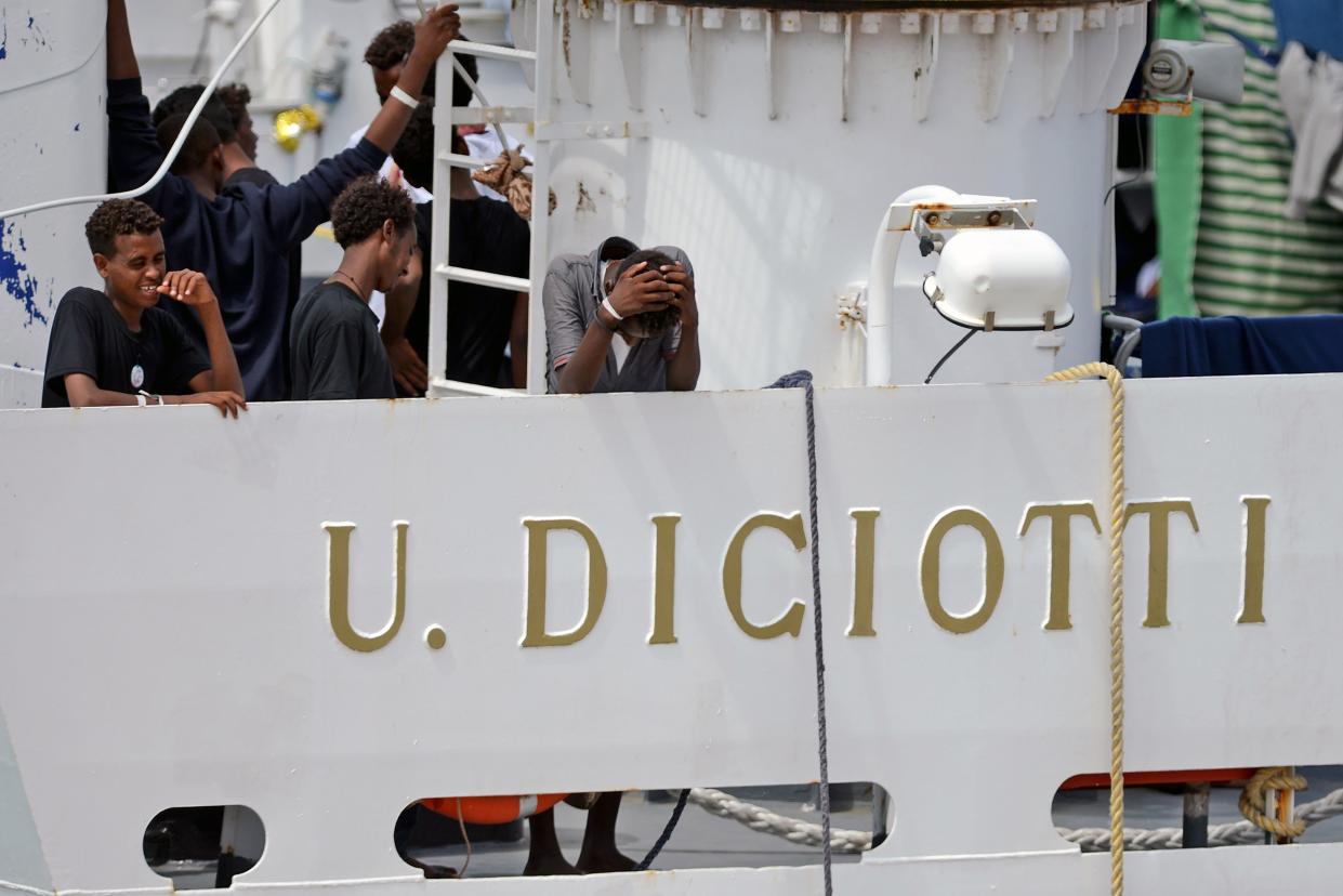 People rescued by the Italian coastguard waiting for a diplomatic stand-off to be resolved so they can disembark (Getty)