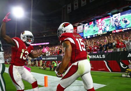 Oct 17, 2016; Glendale, AZ, USA; Arizona Cardinals wide receiver Michael Floyd (15) celebrates with teammate Jaron Brown (13) after catching a fourth quarter touchdown against the New York Jets at University of Phoenix Stadium. Mandatory Credit: Mark J. Rebilas-USA TODAY Sports