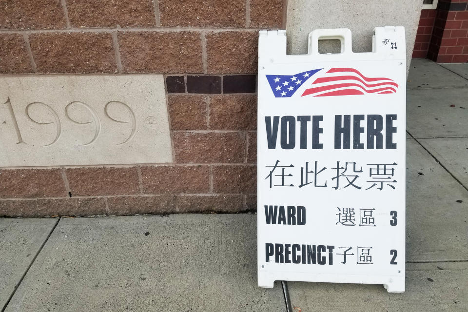 A sign in Chinese and English outside a voting station in Malden, Massachusetts on Election Day, November 3, 2020. Malden qualifies for bilingual voting materials under federal law because of its large Chinese-speaking population. (Amy Yee)