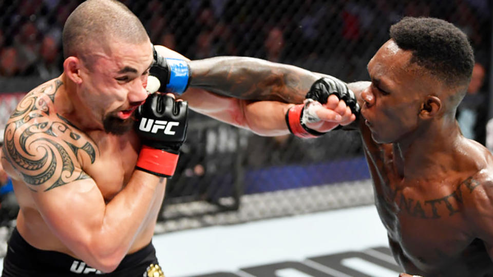 Israel Adesanya, right, was far to good for Robert Whittaker, left, at UFC 243.