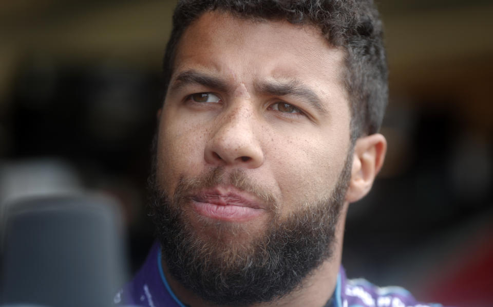 NASCAR driver Darrell Wallace Jr. speaks with a reporter before making a practice run for Sunday’s NASCAR auto race Friday, Feb. 23, 2018, at Atlanta Motor Speedway in Hampton, Ga. (AP Photo/John Bazemore)