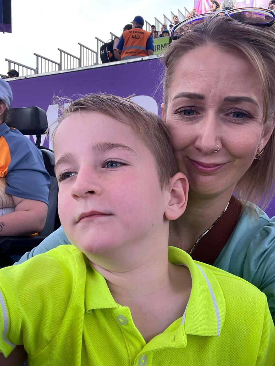 Bobby ended up sitting on mum Amy's lap for three hours so he could see the action. (SWNS)