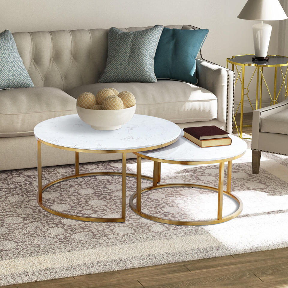 Now, you can get a two coffee tables for the price of one. You can pull out the second table from underneath the first whenever you have guests over. We're loving the mix of marble and gold, which gives this table a glamorous look. <a href="https://fave.co/2SFYdSx" target="_blank" rel="noopener noreferrer">Originally $619, get the set now for $588 at The Home Depot</a>. 