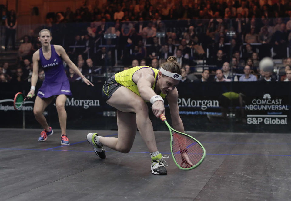 Sarah-Jane Perry, right, returns a shot from Laura Massaro during a semifinal match of the Tournament of Champions squash championship, Wednesday, Jan. 18, 2017, at Grand Central Terminal in New York. Massaro won the best of five match 3-0. (AP Photo/Julie Jacobson)