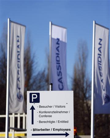 A traffic signboard is seen at the headquarters of EADS defence unit Cassidian is pictured in the German city of Unterschleissheim, north of Munich December 10, 2013. Airbus parent EADS risked a collision with unions and European politicians by unveiling plans on December 10, 2013 to cut defence and space jobs that for a first time include significant forced redundancies, driven by weak European budgets. REUTERS/Michael Dalder