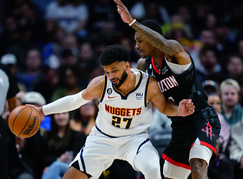 Denver Nuggets guard Jamal Murray (27) is pressured by Houston Rockets guard Kevin Porter Jr. (3) during the second quarter of an NBA basketball game Wednesday, Nov. 30, 2022, in Denver. (AP Photo/Jack Dempsey)