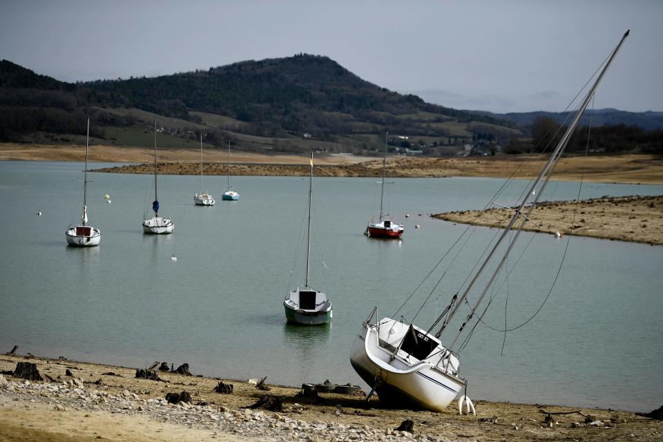 This photograph shows boats on the partially dry Lake Montbel, south-western France, on February 21, 2023.